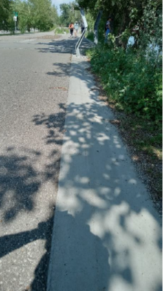 A curb along a bicycle path